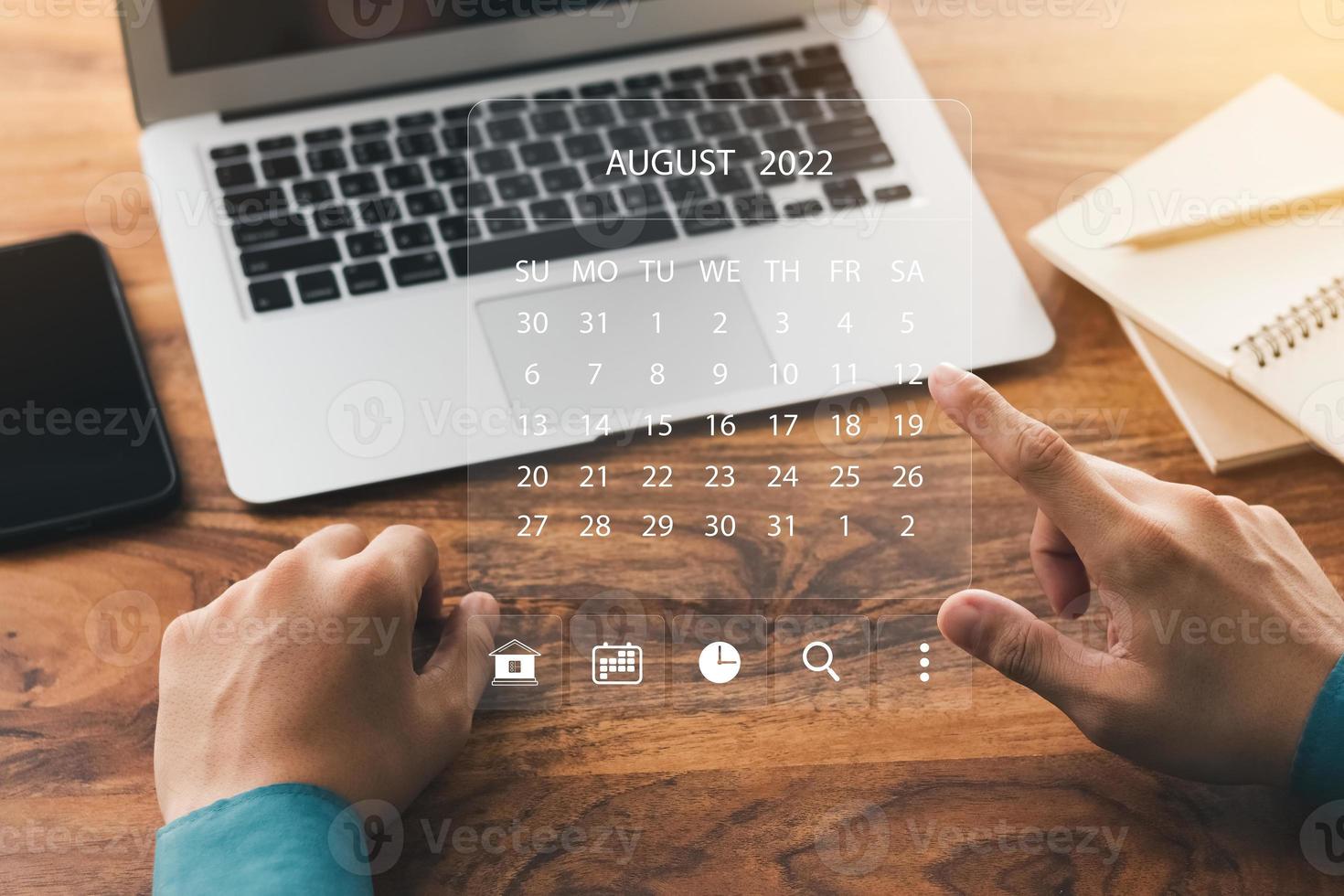 businessman using laptop computer Plan work and update tasks with milestone progress planning and virtual chart scheduling diagrams. photo