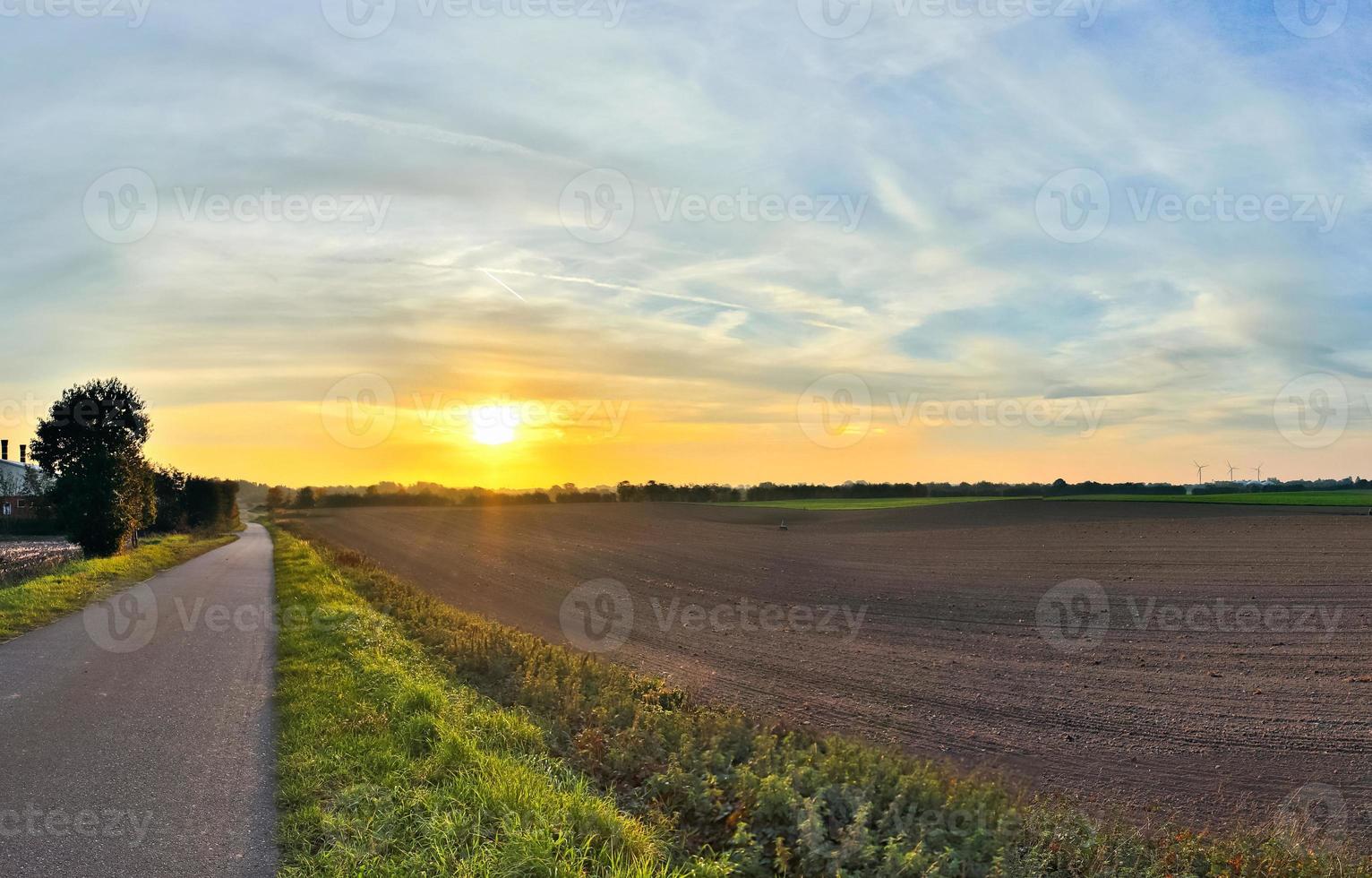 Beautiful high resolution panorama of a northern european country landscape with fields and green grass photo