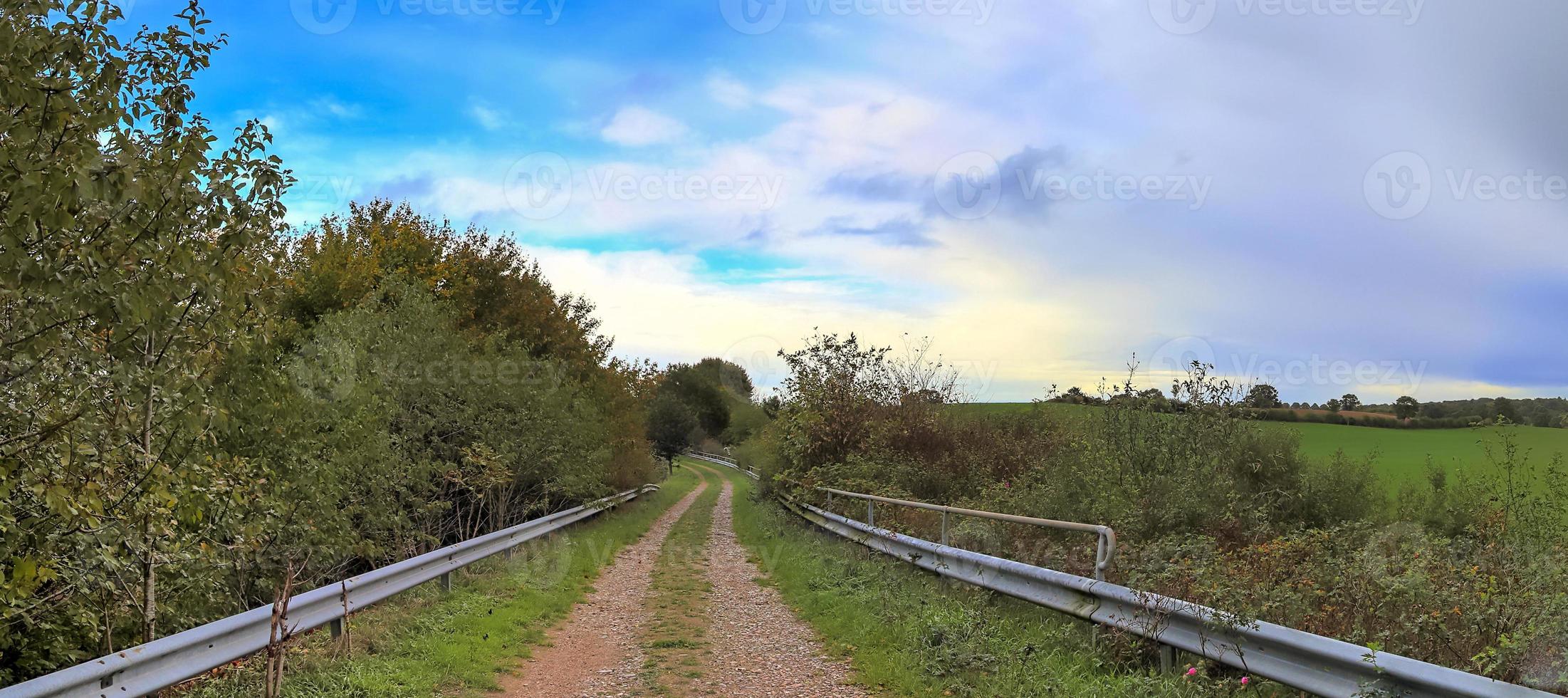 Beautiful high resolution panorama of a northern european country landscape with fields and green grass photo