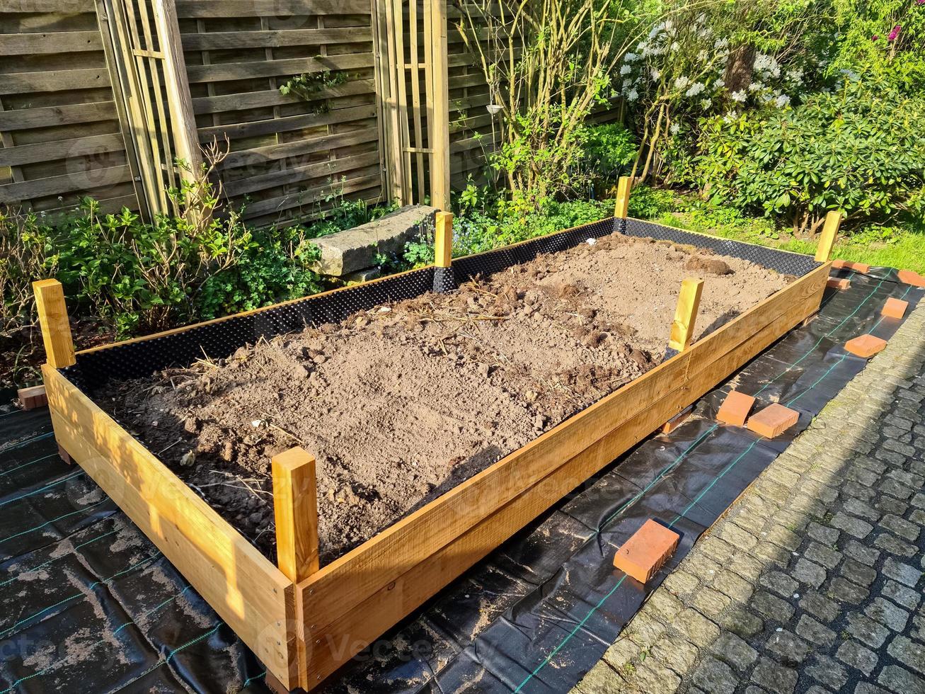 Raised herbal bed during construction in a german garden. photo