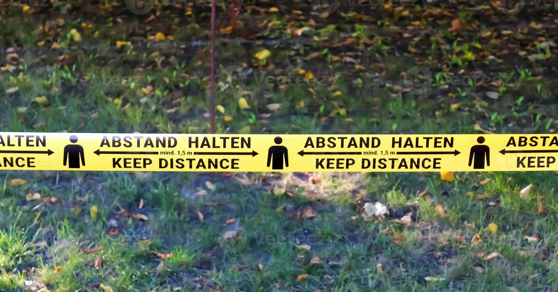 Keep distance symbol in german language 2 meter social distancing sign for COVID 19. photo