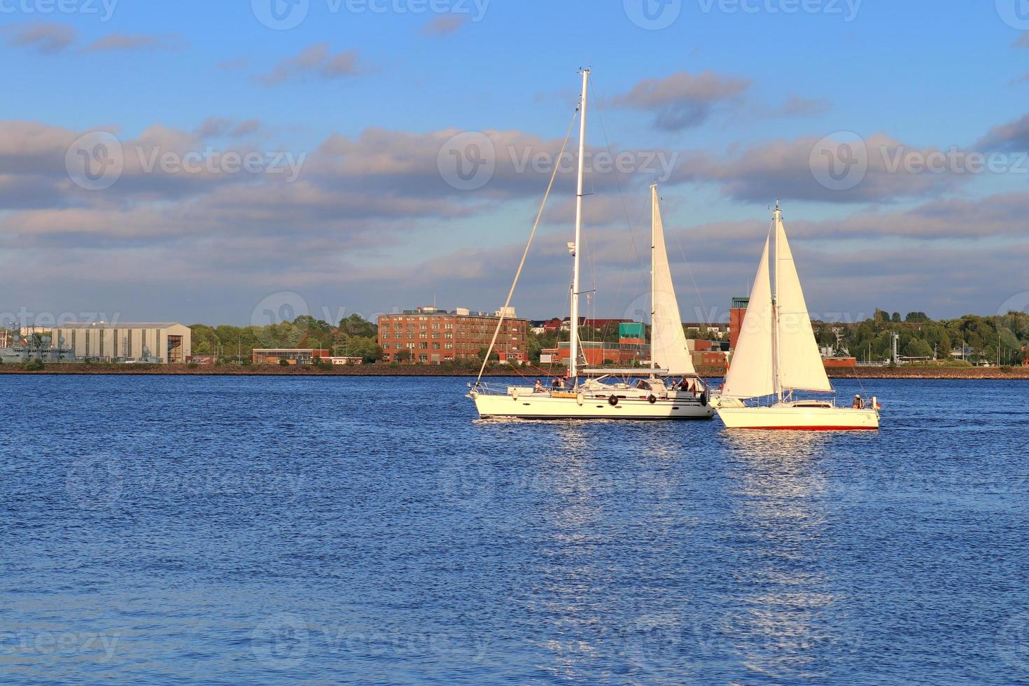 View on the baltic sea at the port of Kiel with some boats and ships photo