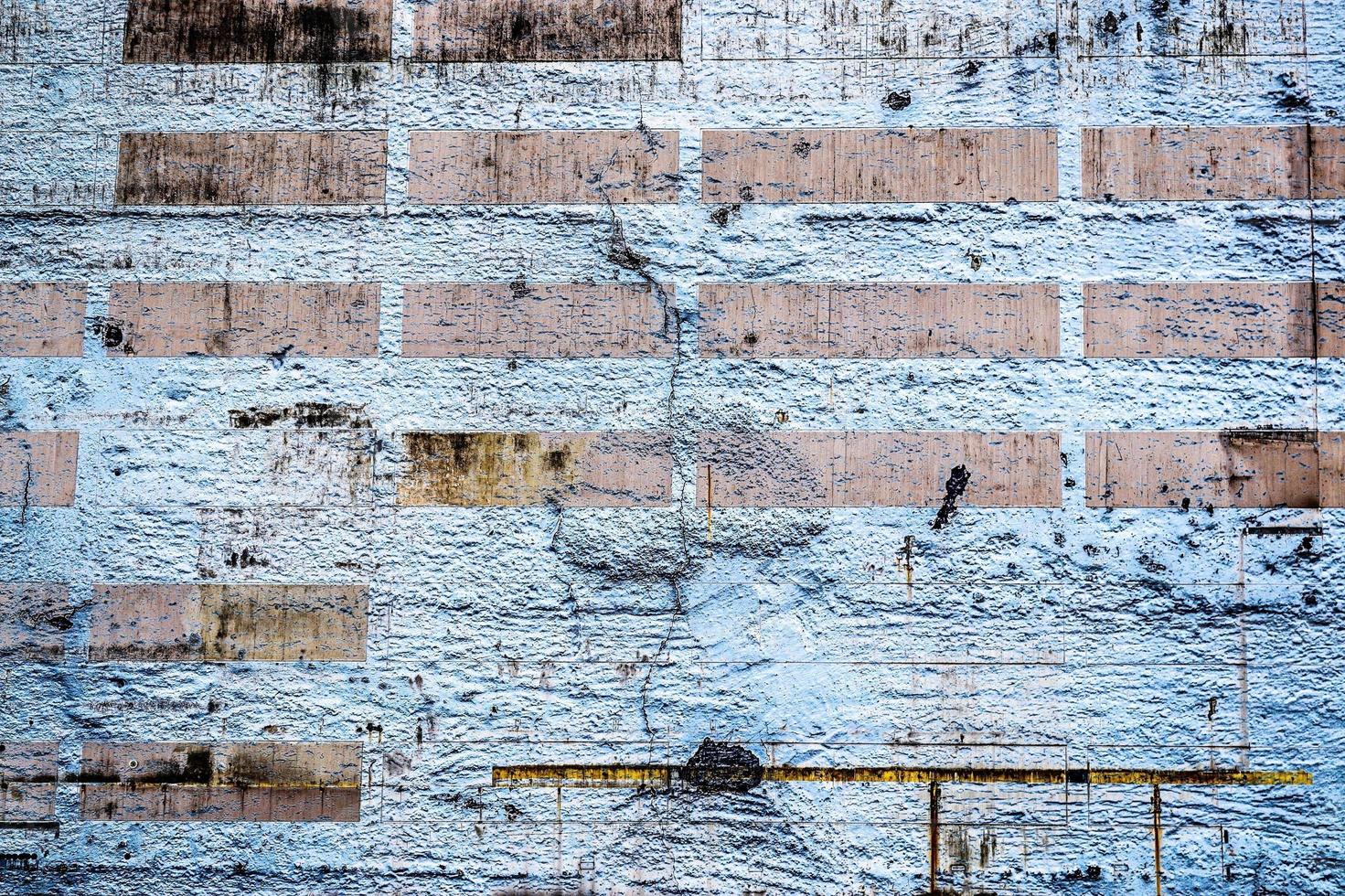 Detailed view on aged concrete walls with cracks and a lot of structure in high resolution photo
