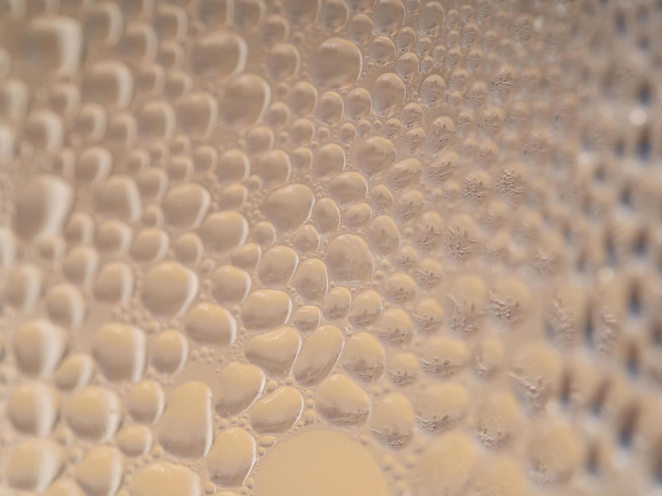 Water drops background texture. Backdrop glass covered with drops of water. bubbles in water photo