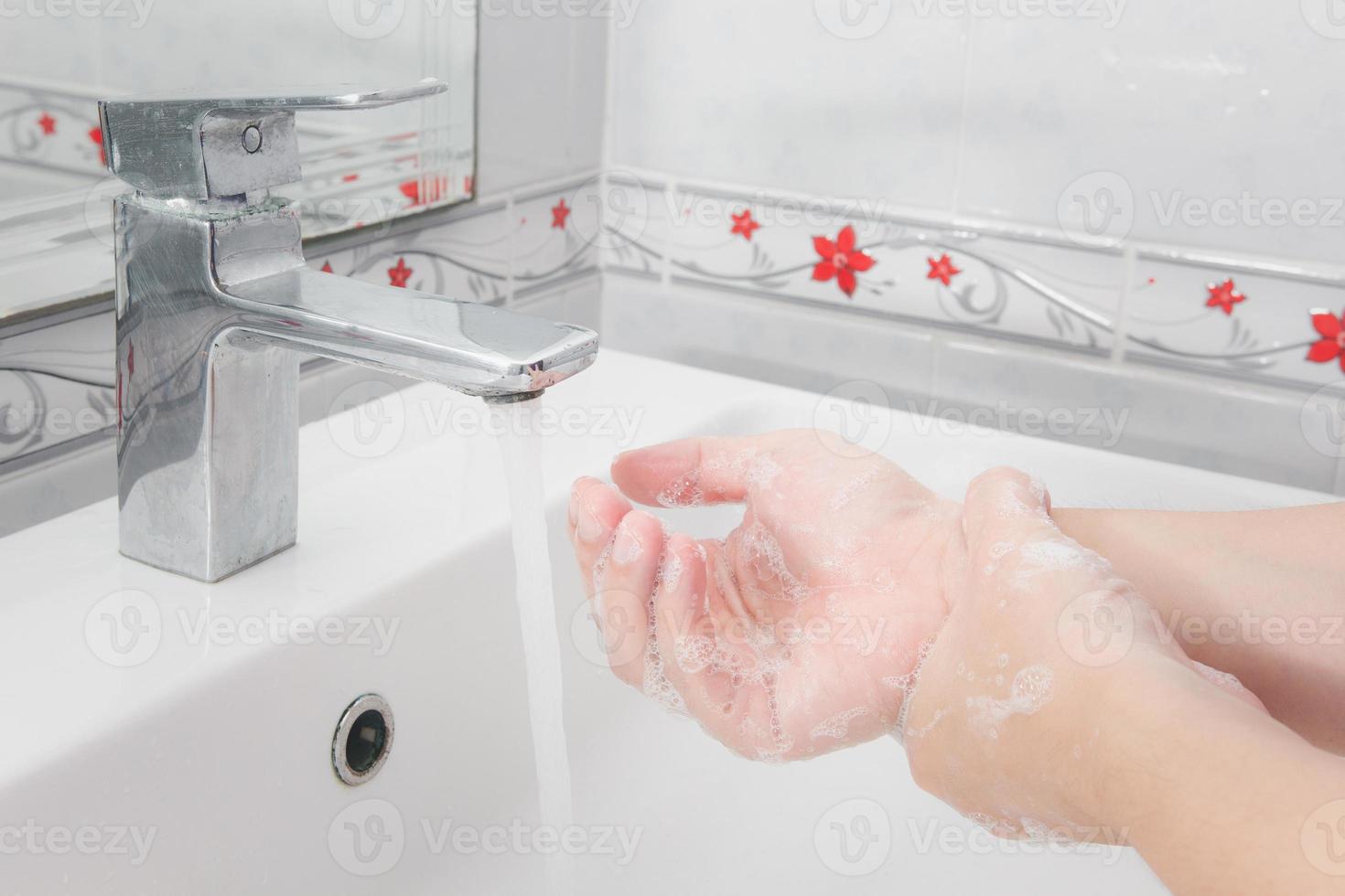 Both hands are washing their hands in the sink.Hygiene concept. photo