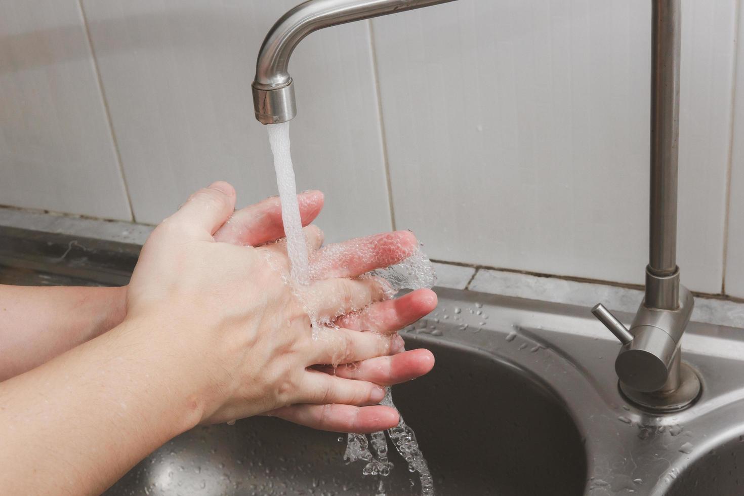 Both hands are washing their hands in the sink.Hygiene concept. photo