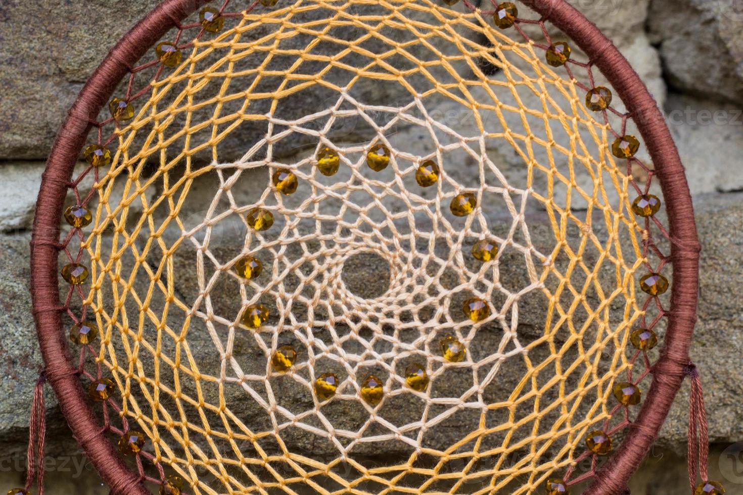 Handmade dream catcher with feathers threads and beads rope hanging photo
