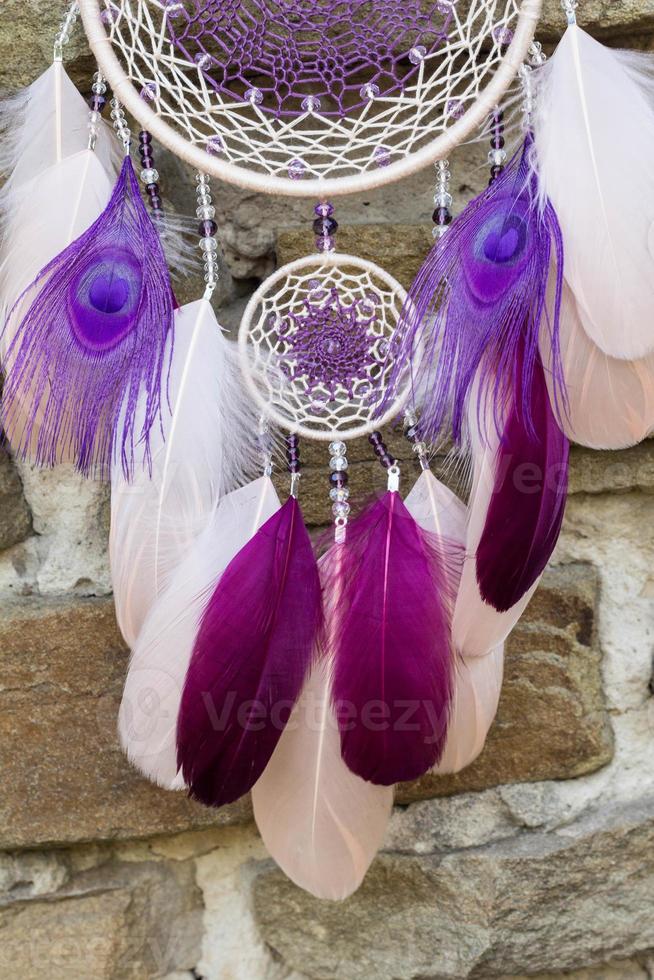 Handmade dream catcher with feathers threads and beads rope hanging photo