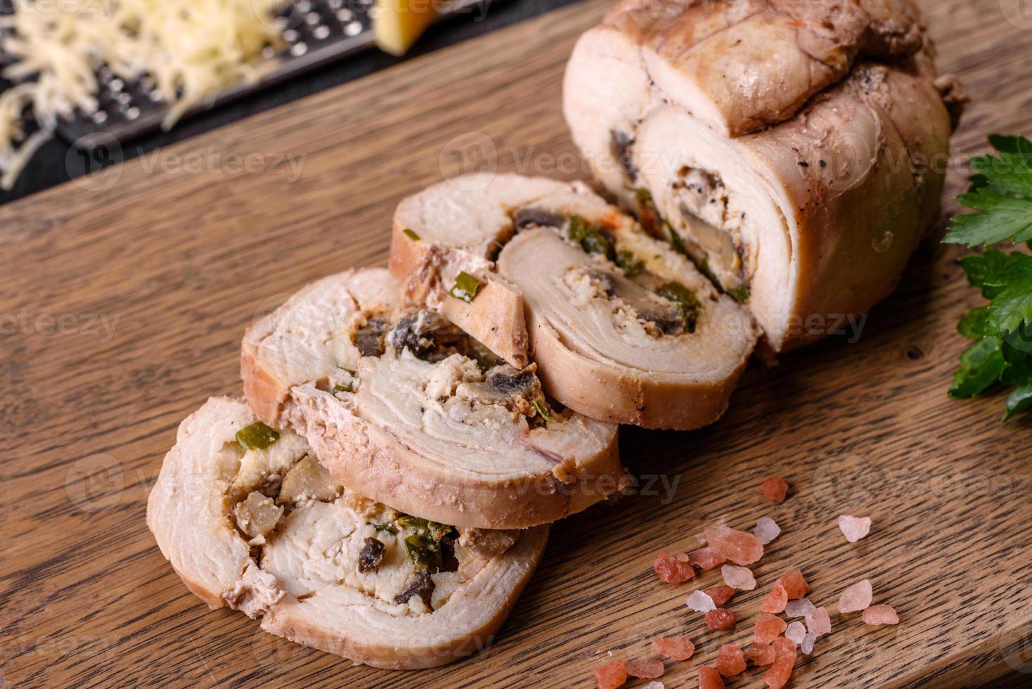 Delicious fresh meat roll made from chicken fillet, mushrooms, spices and herbs photo