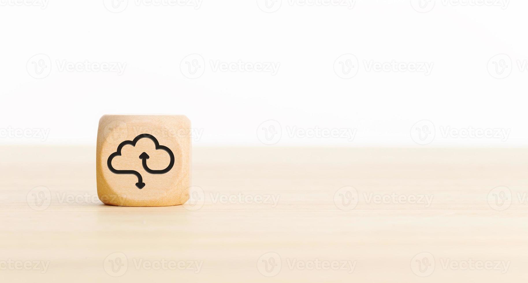 Cloud computing icon on wooden block. Copy space photo