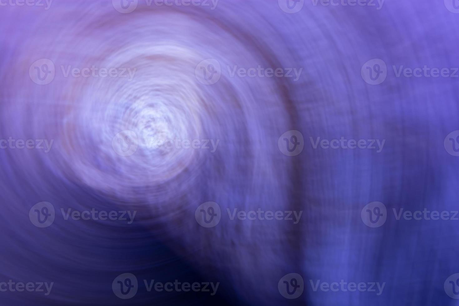 Abstract spiral background in blue purple tones. photo