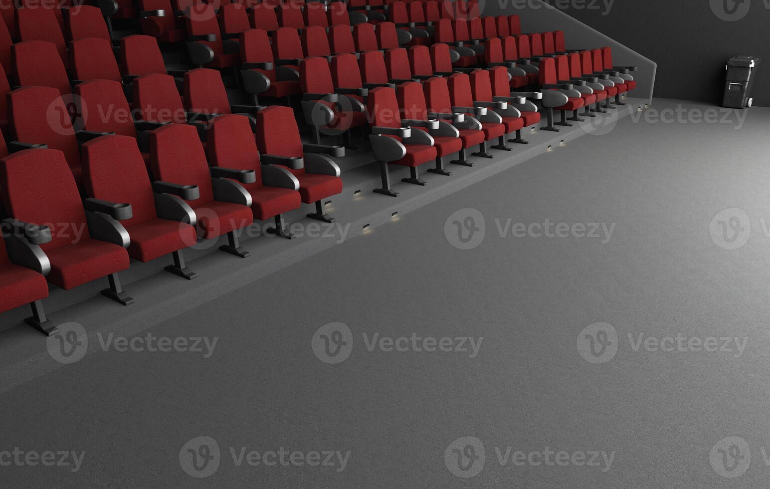 Spacious cinema auditorium with red chairs photo