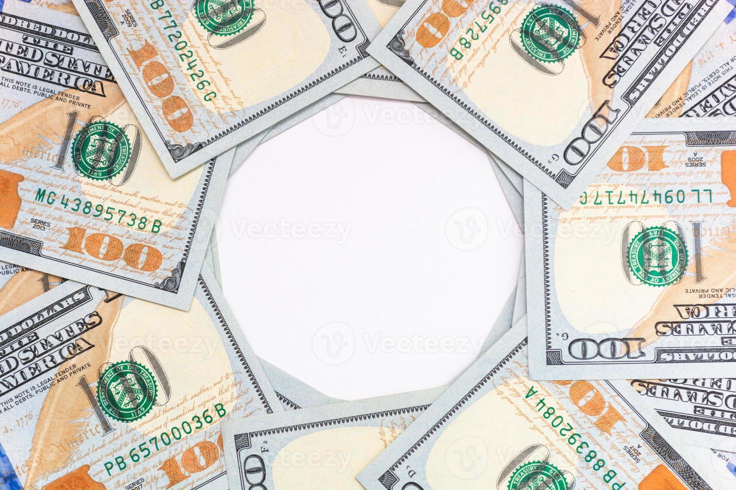 Background of 100 dollar American bills with a white circle in the middle. photo