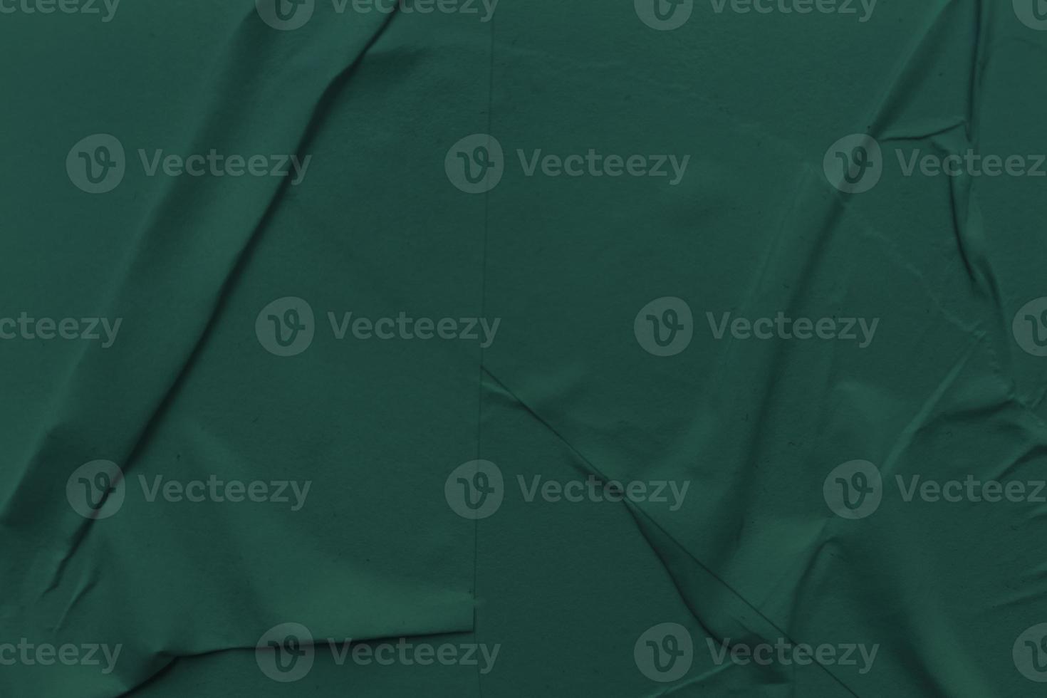 Blank green paper is crumpled texture background. Crumpled paper texture backgrounds for various purposes photo
