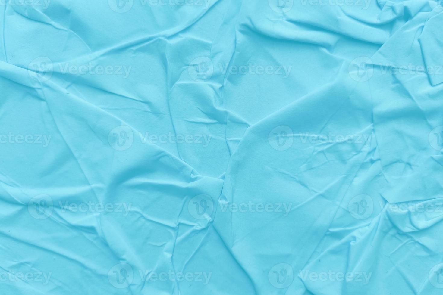 Blank blue paper is crumpled texture background. Crumpled paper texture backgrounds for various purposes photo