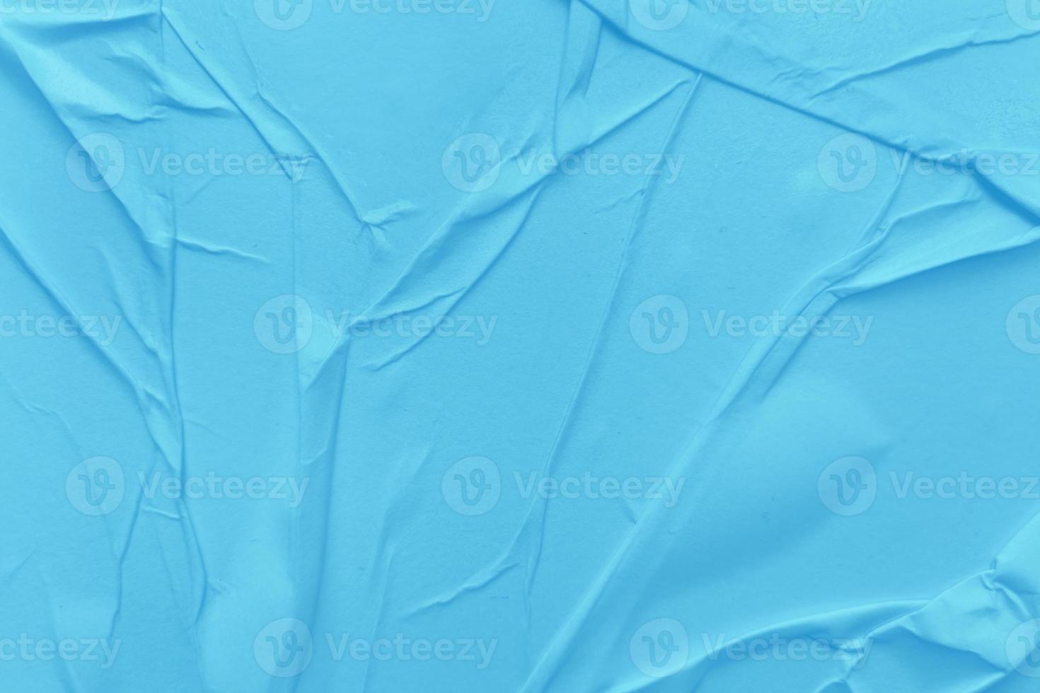 Blank blue paper is crumpled texture background. Crumpled paper texture backgrounds for various purposes photo
