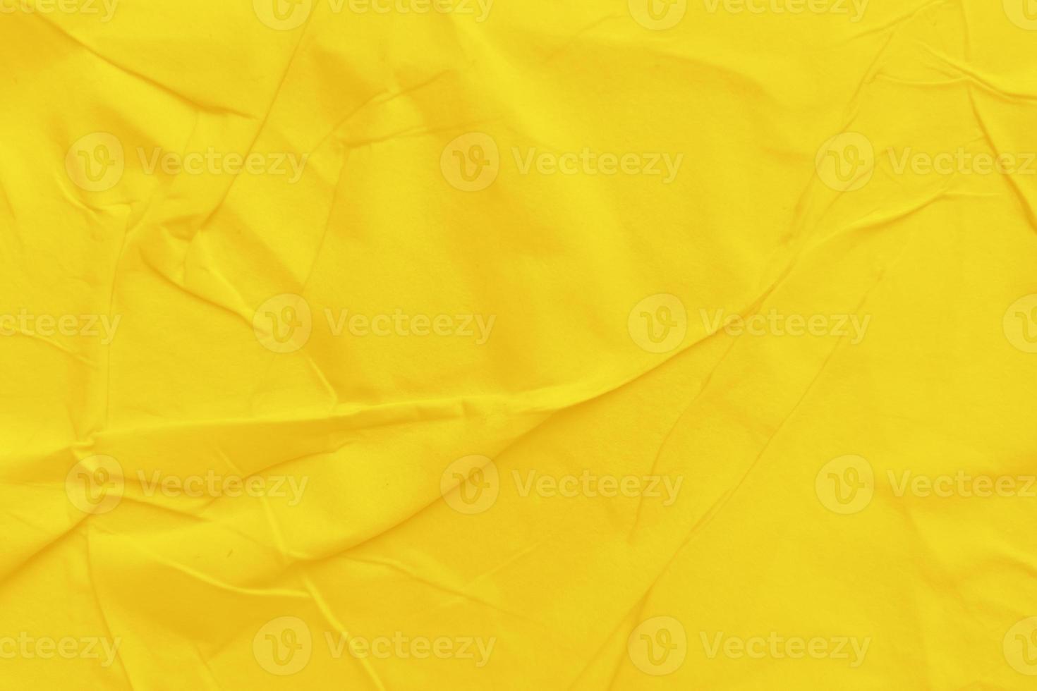Blank yellow paper is crumpled texture background. Crumpled paper texture backgrounds for various purposes photo