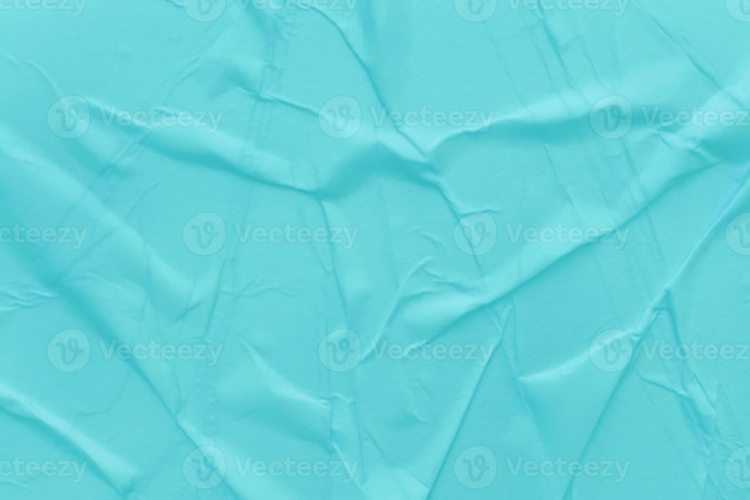 Blank blue paper is crumpled texture background. Crumpled paper texture backgrounds for various purposes photo