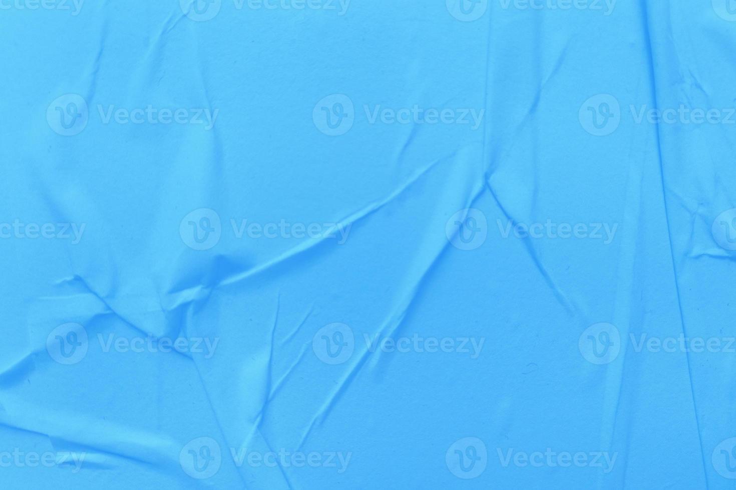 Blank blue paper is crumpled texture background. Crumpled paper texture backgrounds for various purposes photo