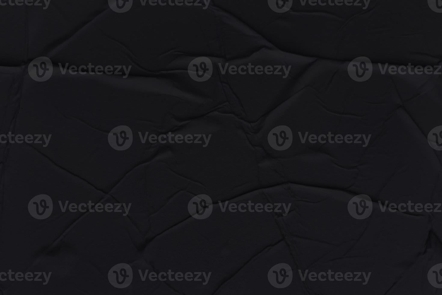 Blank black paper is crumpled texture background. Crumpled paper texture backgrounds for various purposes photo