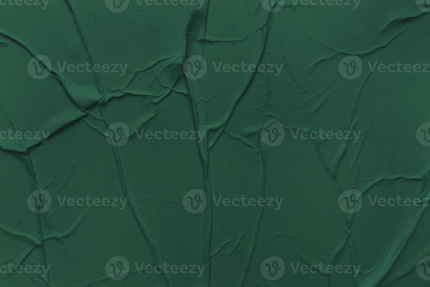 Blank green paper is crumpled texture background. Crumpled paper texture backgrounds for various purposes photo