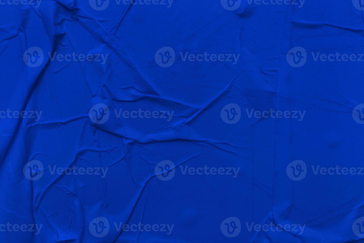 Blank blue paper is crumpled texture background. Crumpled paper texture backgrounds for various purposes photo