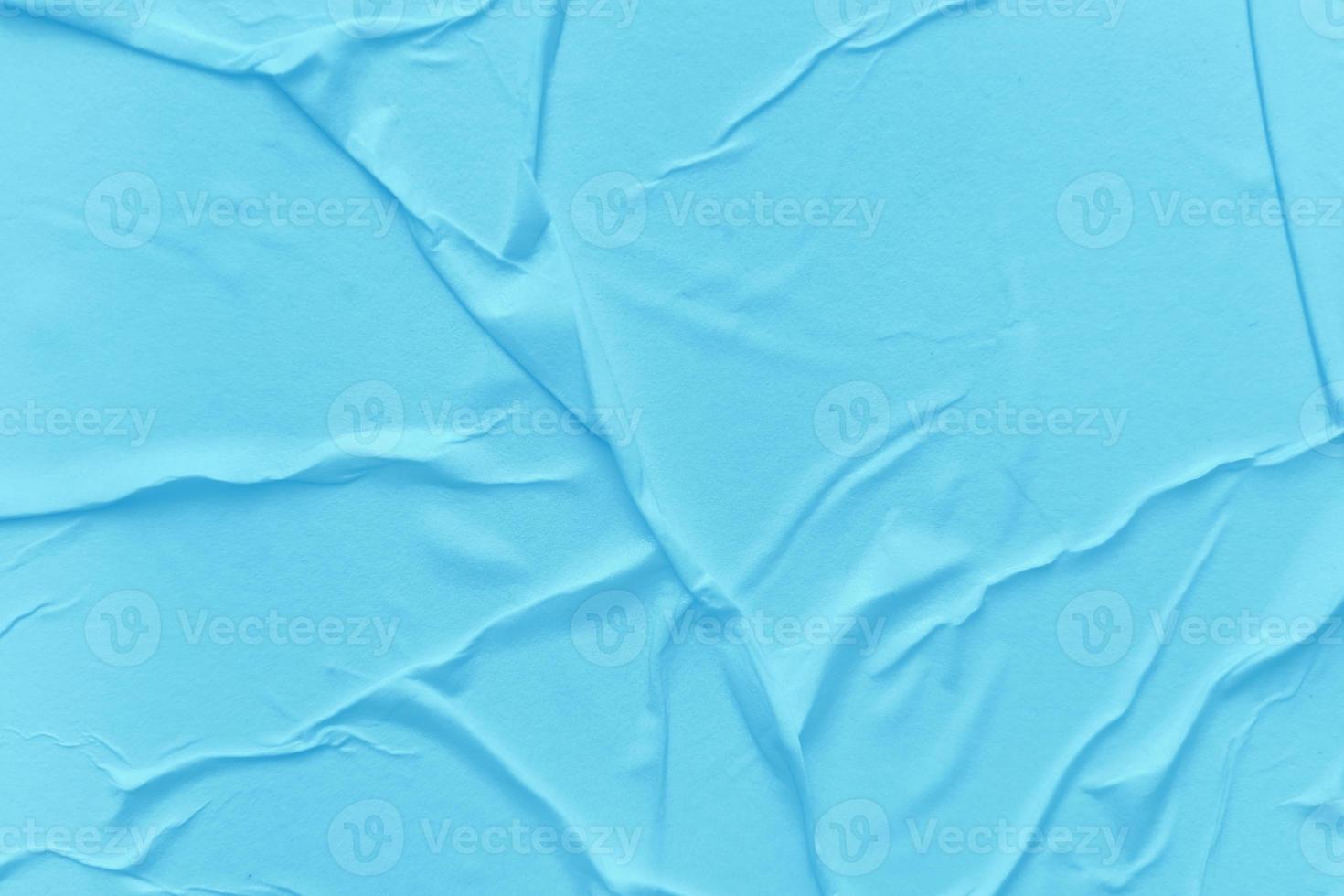Blank blue paper is crumpled texture background. Crumpled paper texture backgrounds for various purposes photo