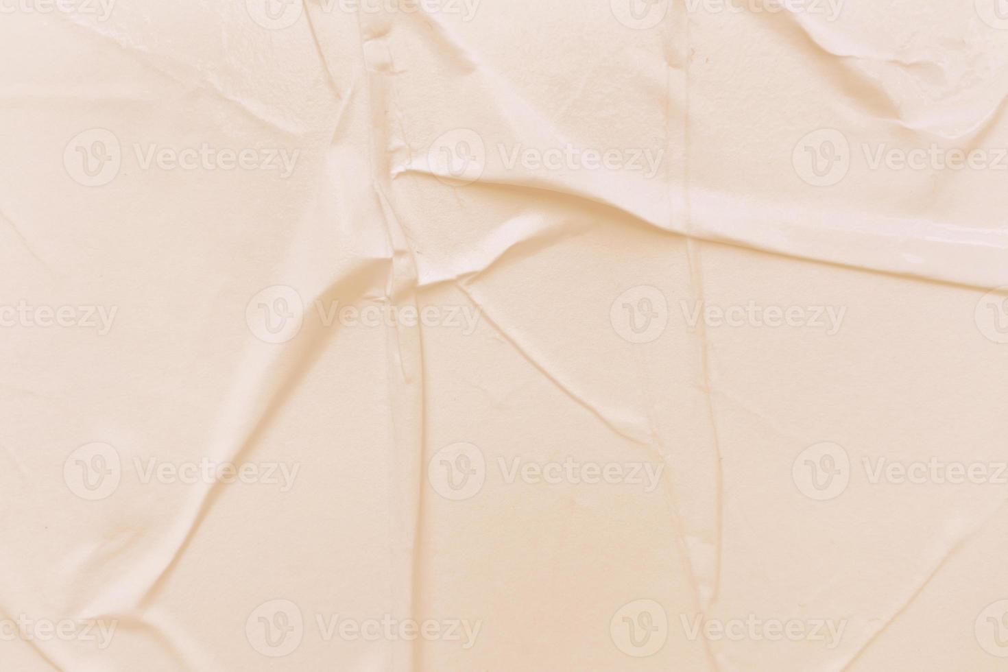 Blank cream paper is crumpled texture background. Crumpled paper texture backgrounds for various purposes photo