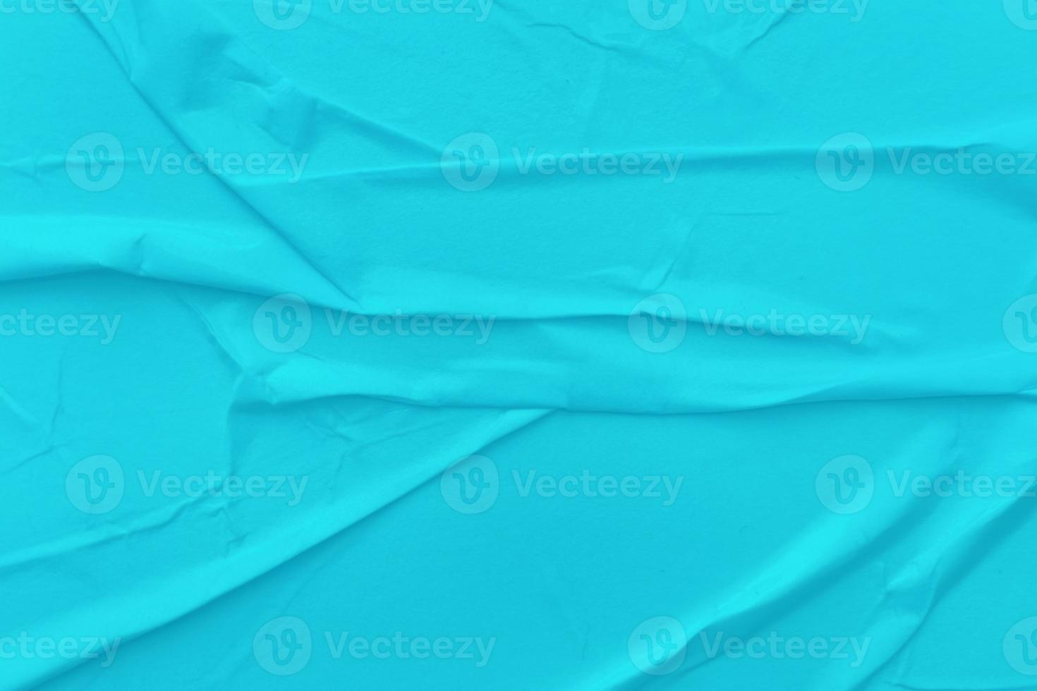 Blank blue paper is crumpled texture background. Crumpled paper texture backgrounds for various purposes photo