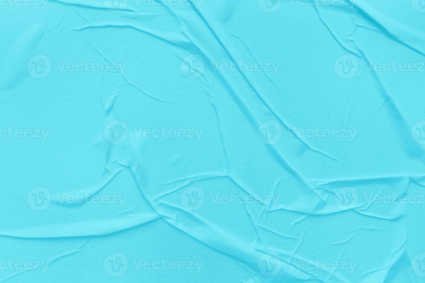 Blank blue paper is crumpled texture background. Crumpled paper texture backgrounds for various purposes photo