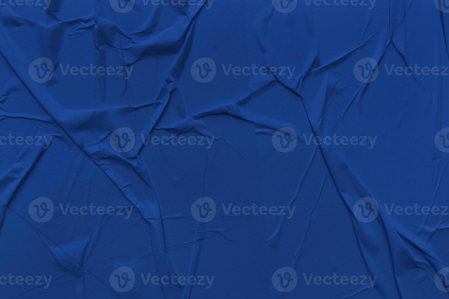 Blank blue paper is crumpled texture background. Crumpled paper texture backgrounds for various purposes photo