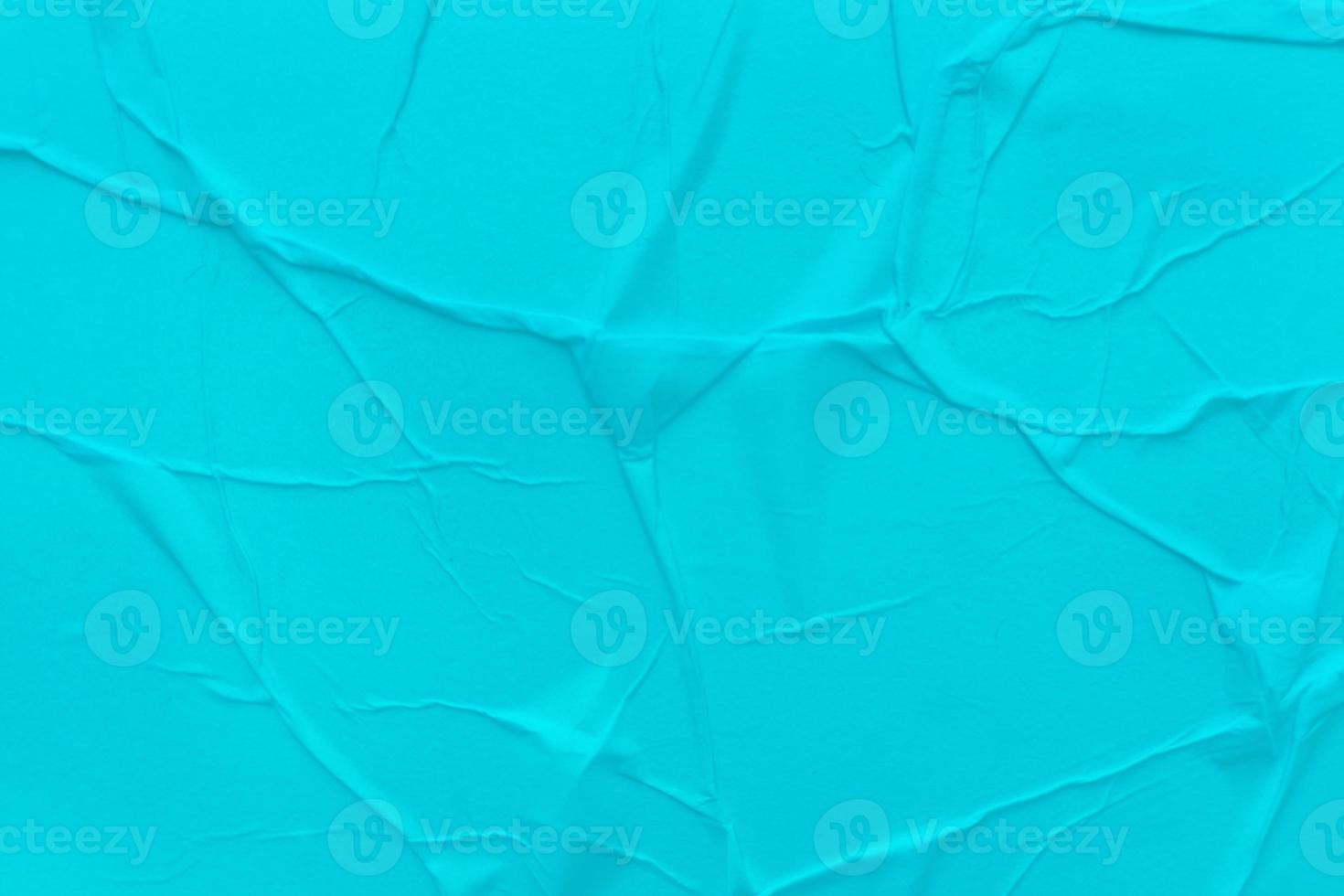 Blank blue paper is crumpled texture background. Crumpled paper texture backgrounds for various purposes photo