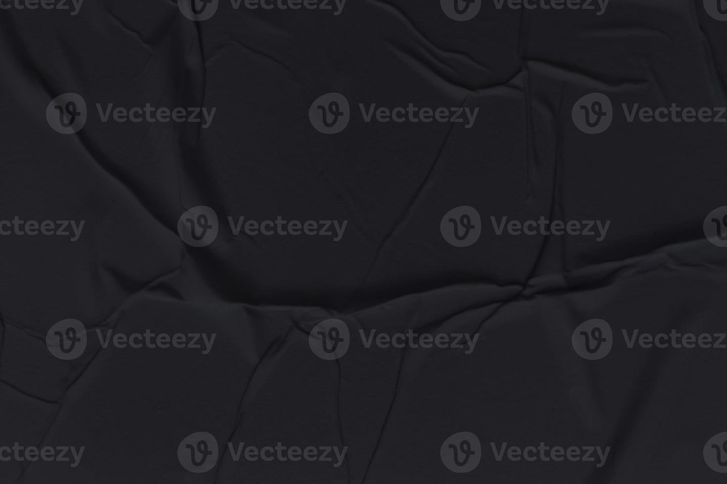 Blank black paper is crumpled texture background. Crumpled paper texture backgrounds for various purposes photo