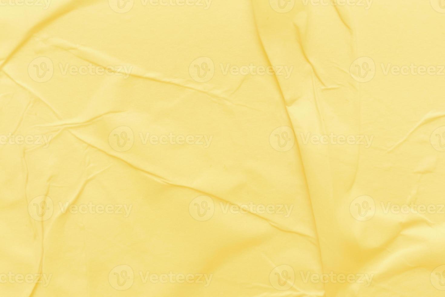 Blank yellow paper is crumpled texture background. Crumpled paper texture backgrounds for various purposes photo