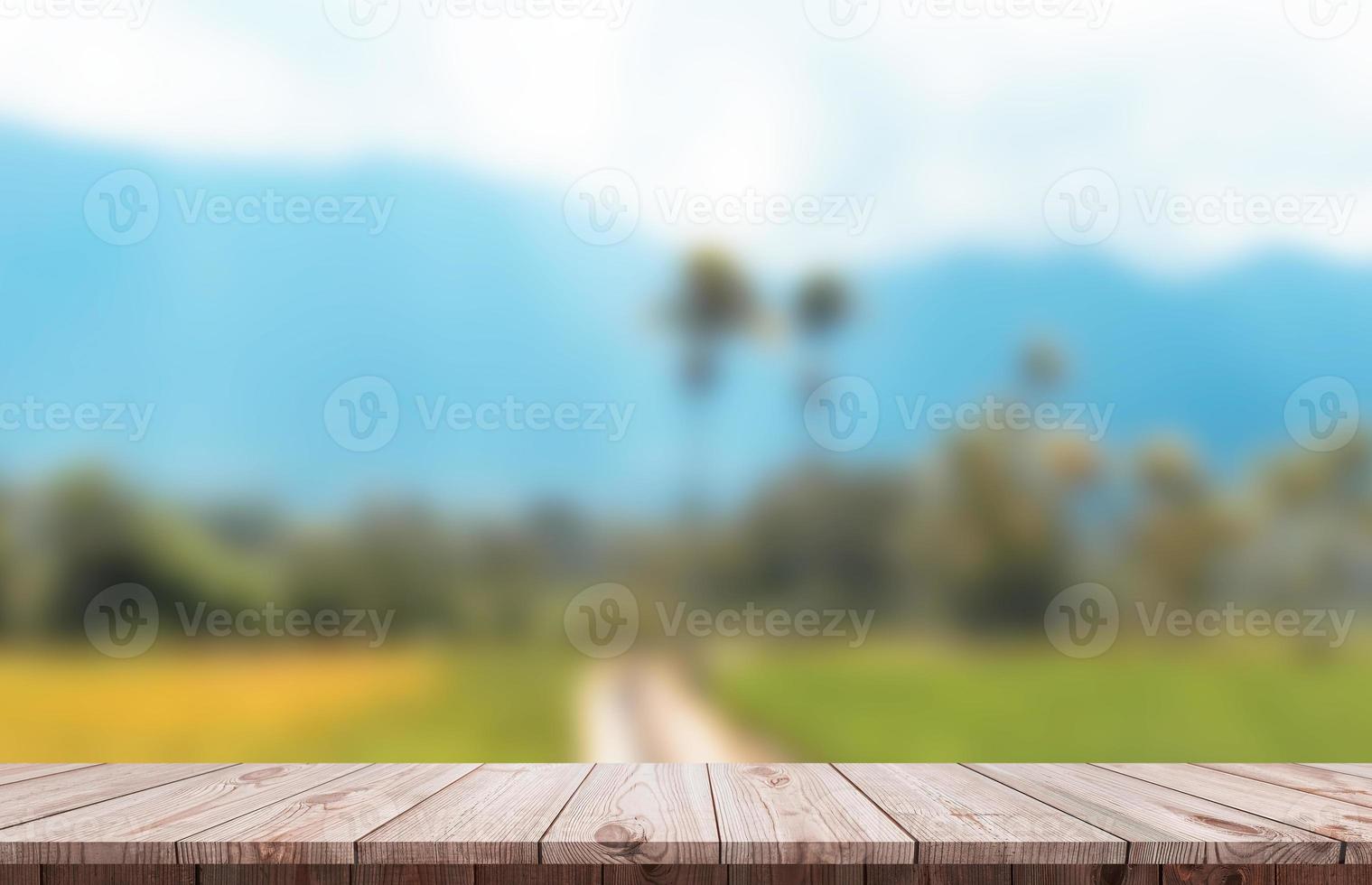 Wood table top and blur glass window For montage product display photo