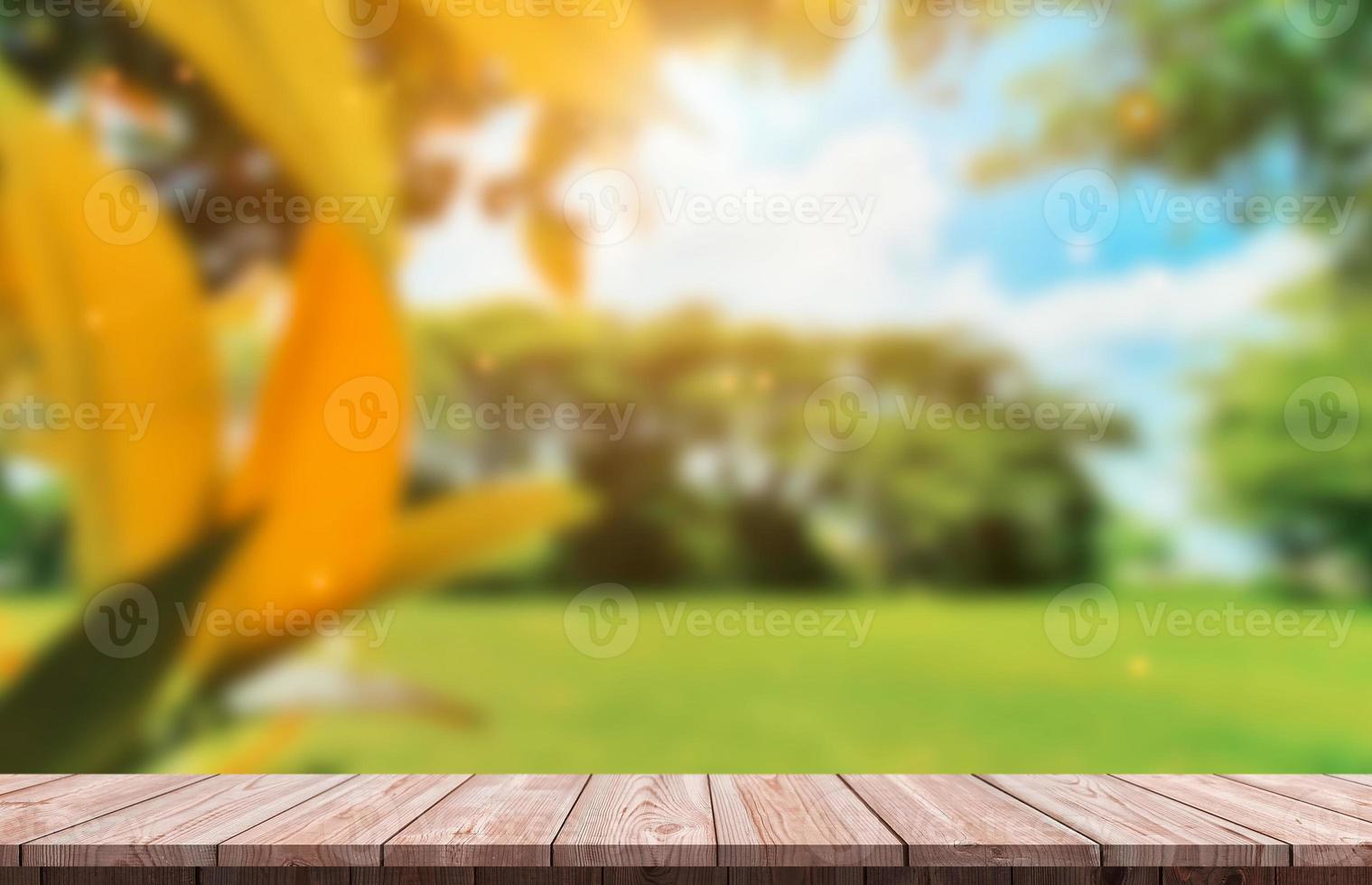 Wood table top and blur glass window For montage product display photo