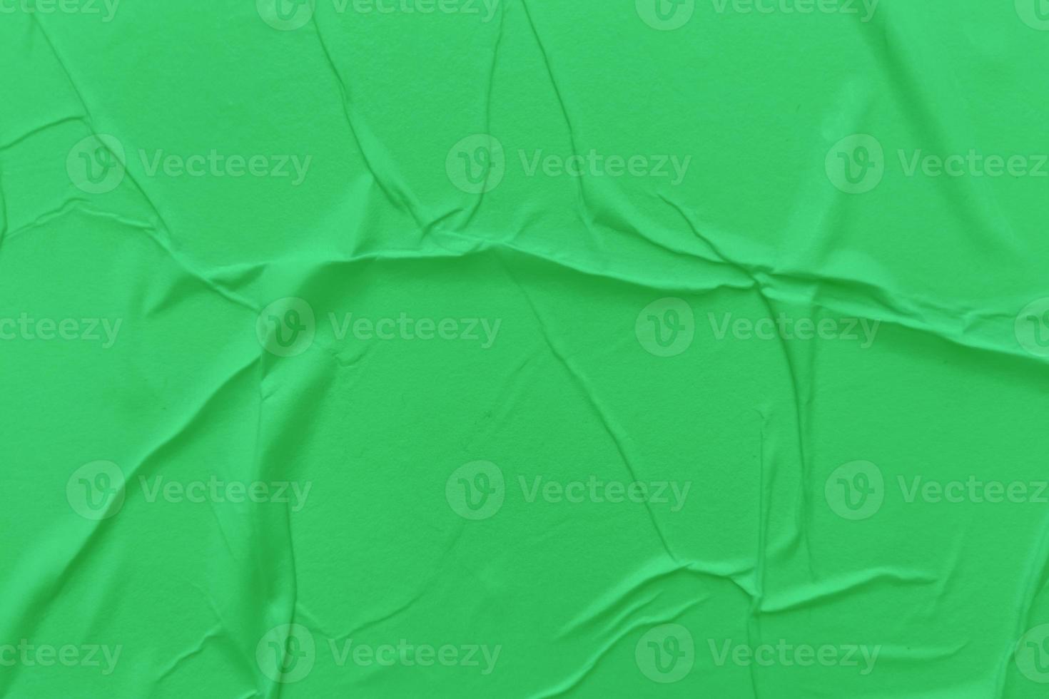 Blank green paper is crumpled texture background. Crumpled paper texture backgrounds for various purposes photo