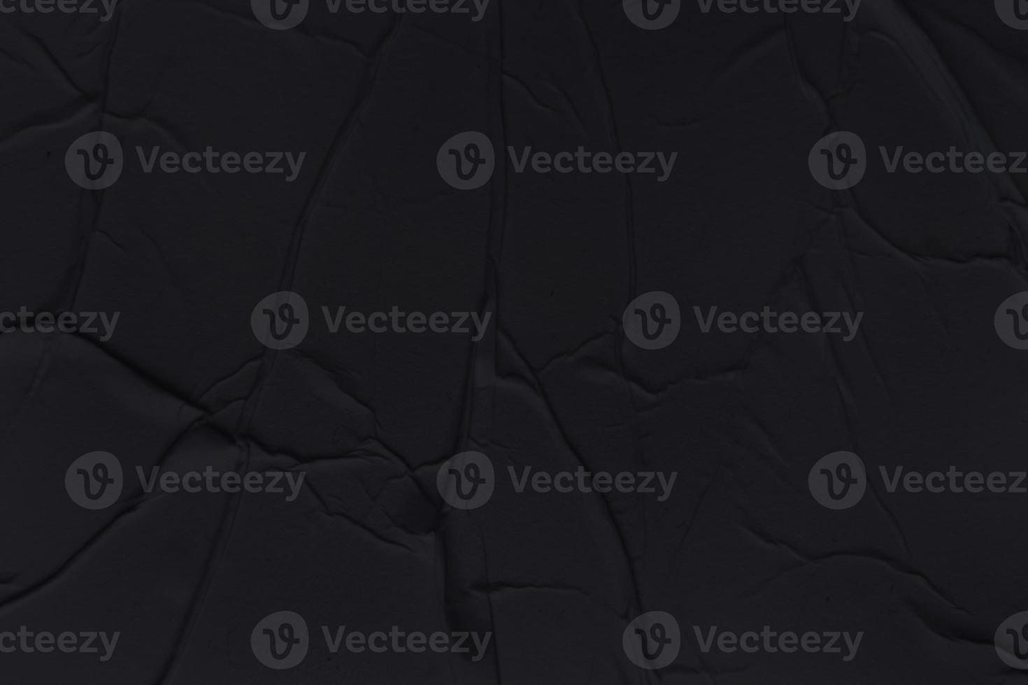 Blank black paper is crumpled texture background. Crumpled paper texture backgrounds for various purposes photo