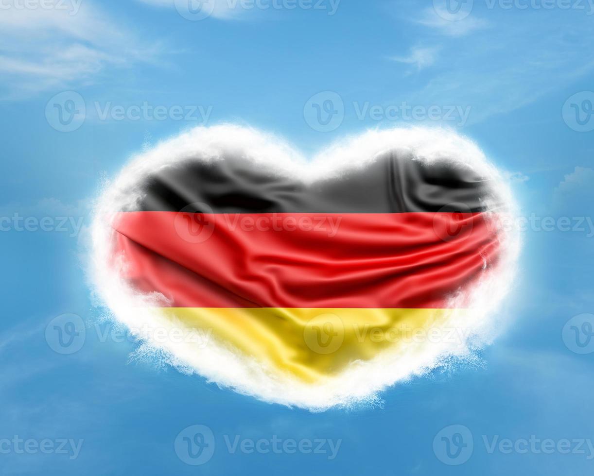 German flag in heart shape in blue sky photo