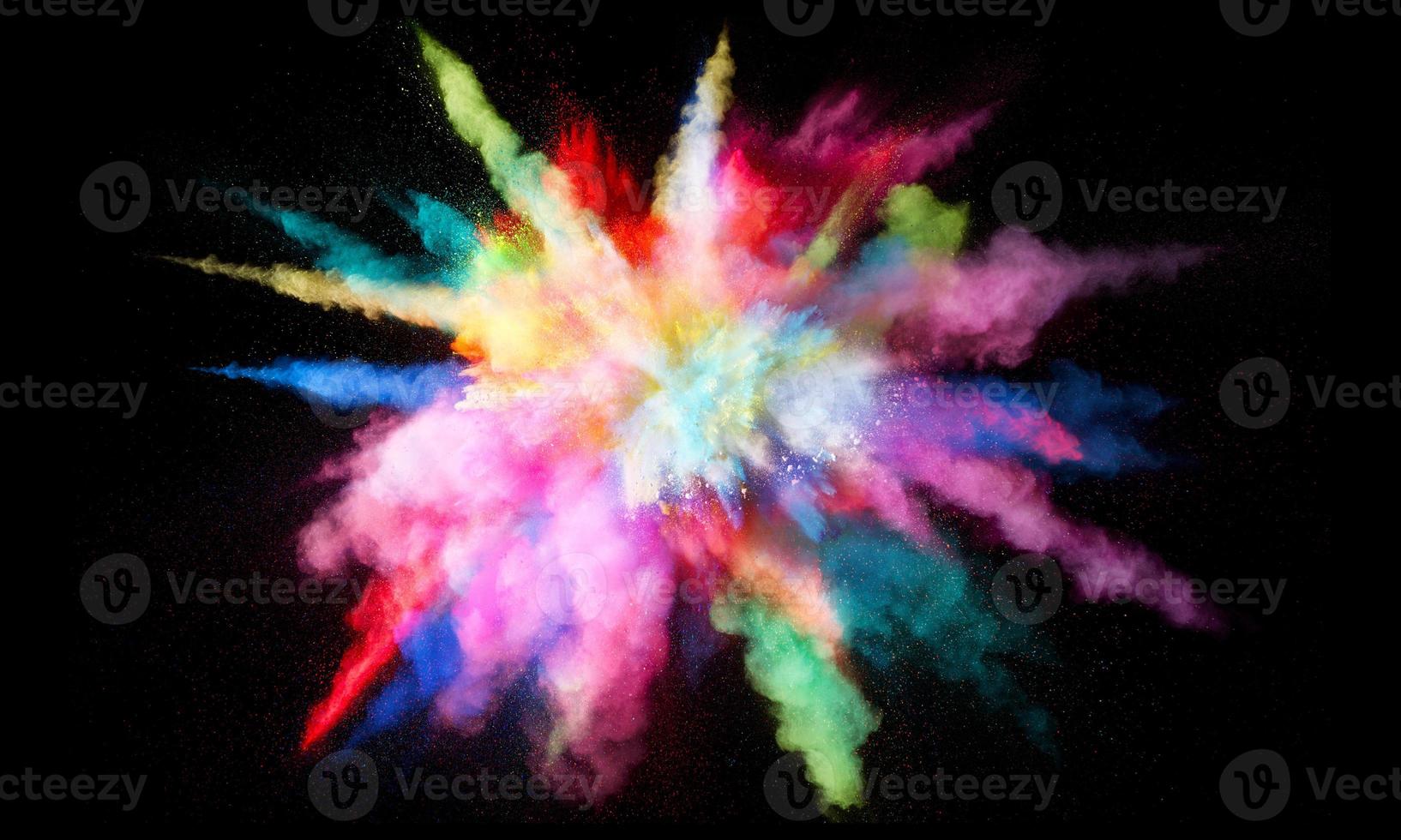 Colorful powder explosion, isolated on black background photo