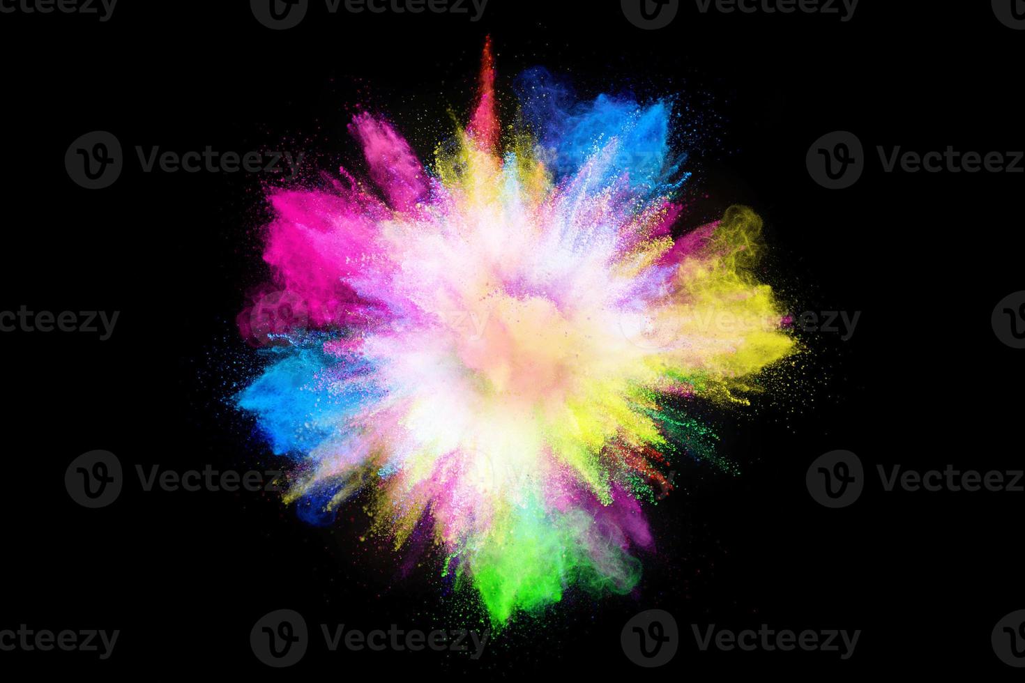 Colorful powder explosion, isolated on black background photo