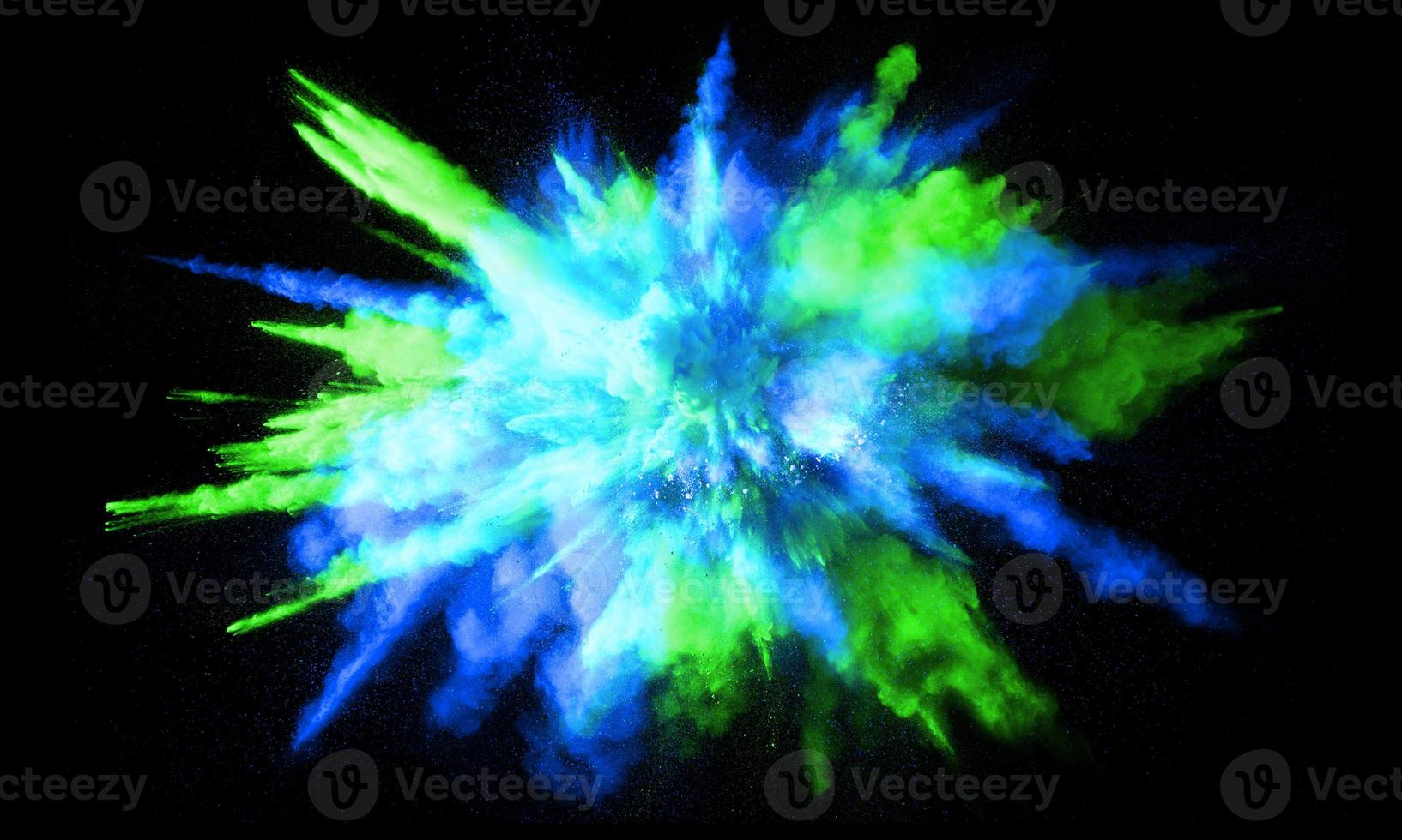 Colorful powder explosion, isolated on black background photo