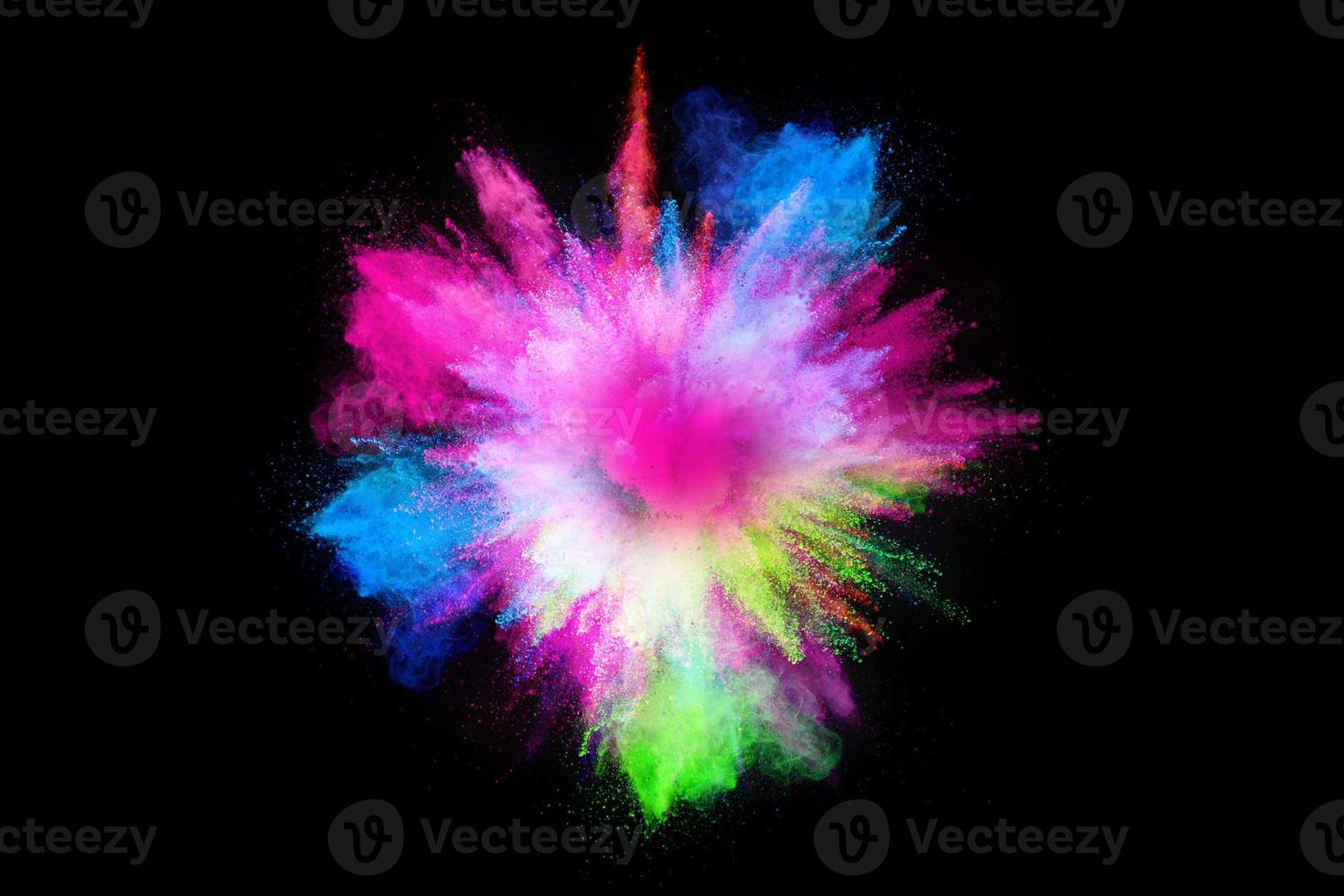 Colorful powder explosion, isolated on black background photo