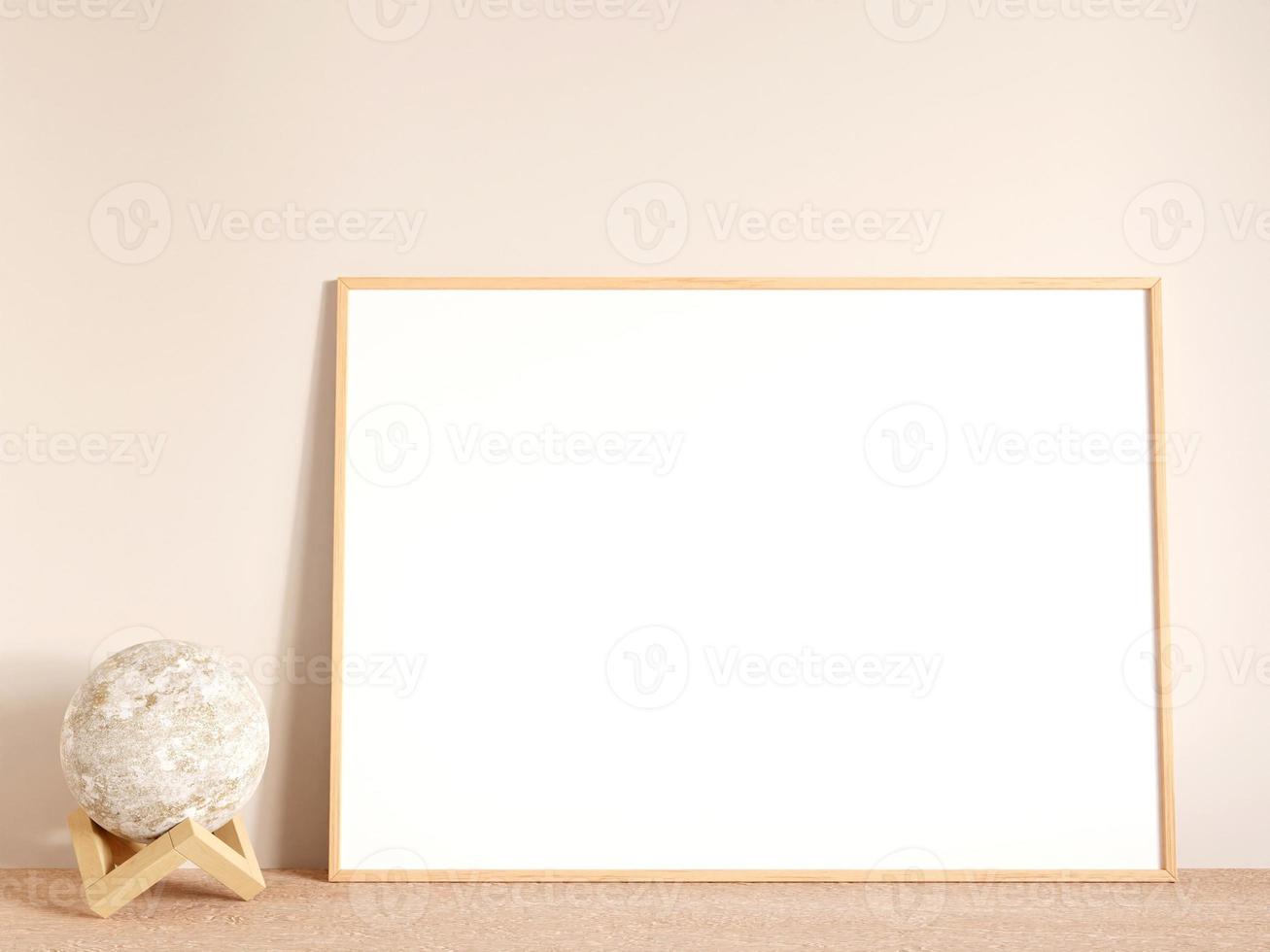 Modern and minimalist horizontal wood poster or photo frame mockup on the living room wooden table. 3d rendering.