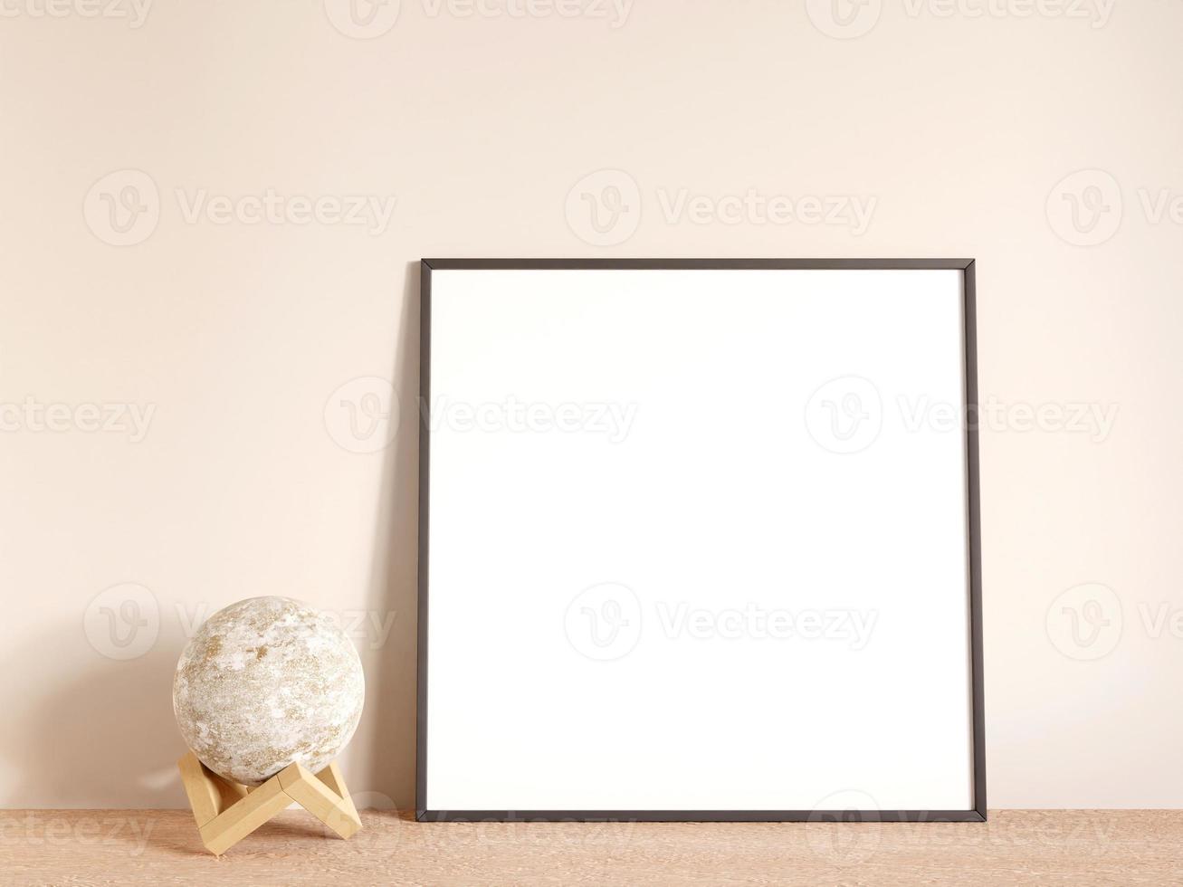Modern and minimalist square black poster or photo frame mockup on the living room wooden table. 3d rendering.