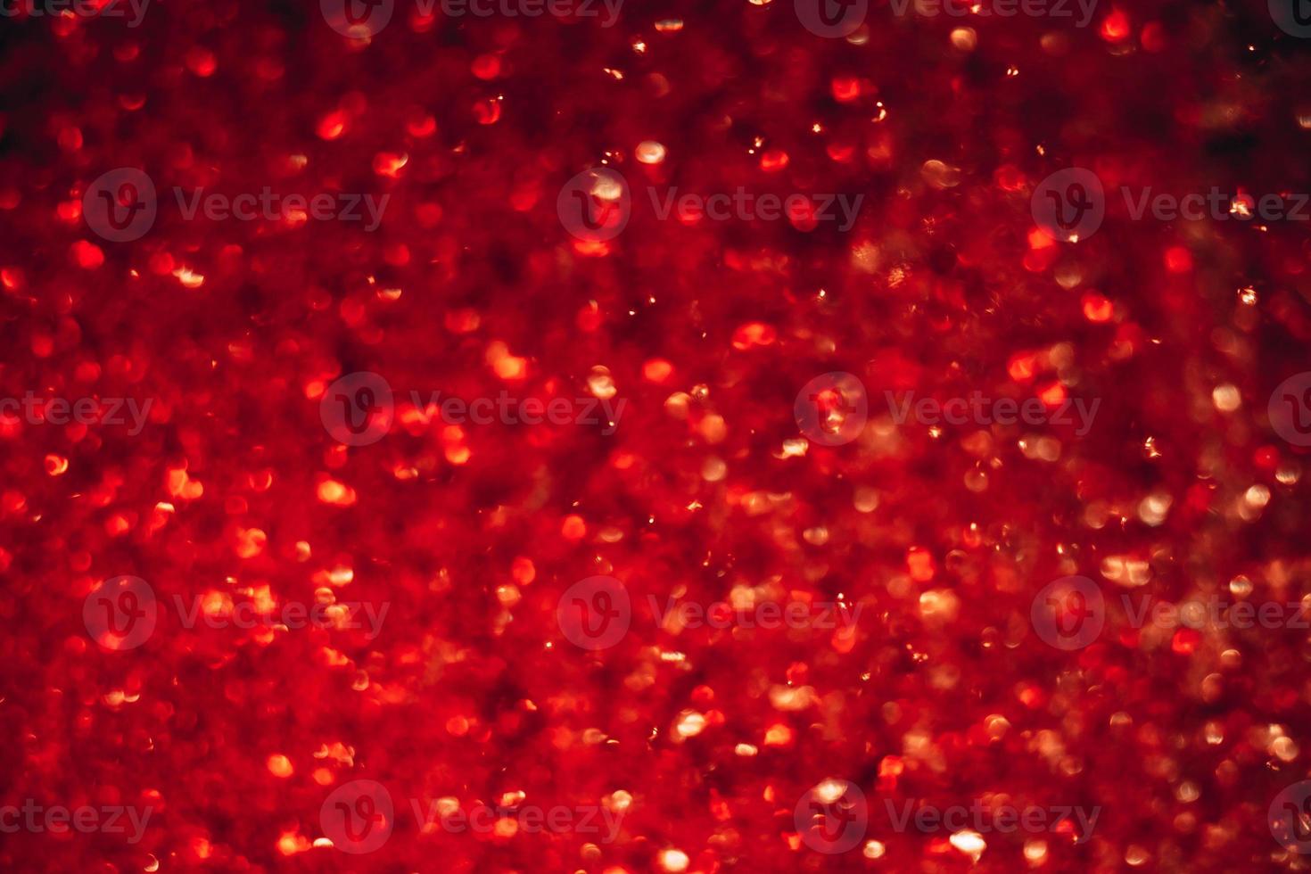 Space abstract background. Christmas backdrop. Texture of red shiny crystals. photo