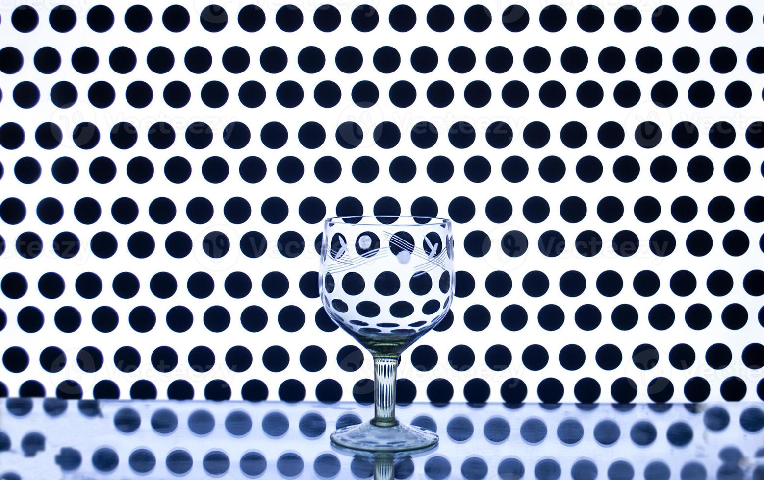 Glass wine glass on a background of circles photo