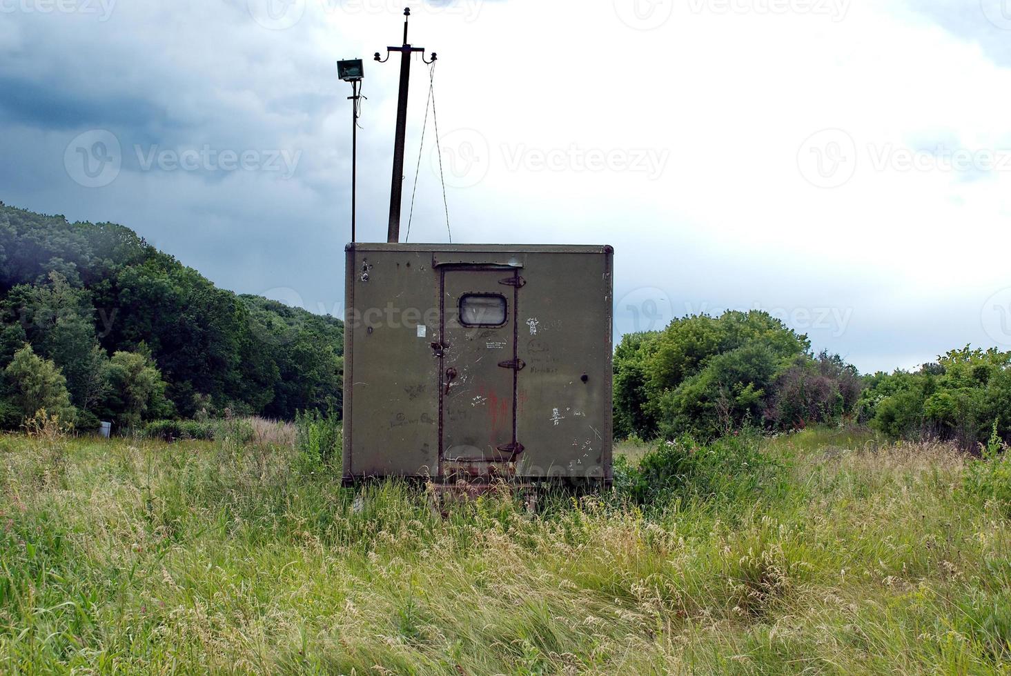 iron booth and concrete pillar photo