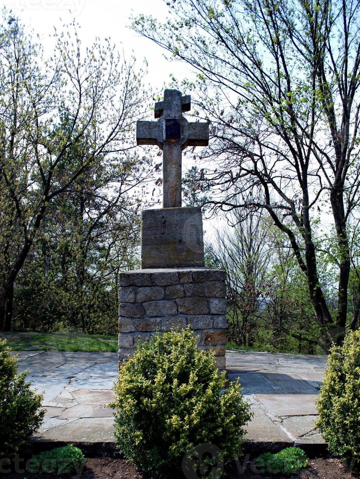 stone cross on a stone foundation photo