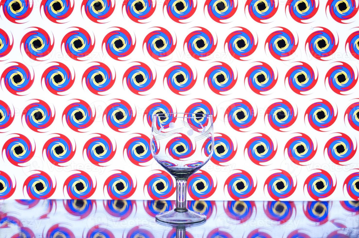 glass wine glass on a colored background photo